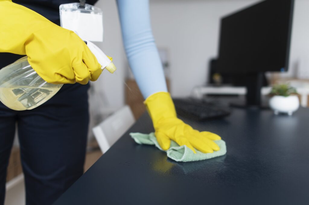 person-taking-care-office-cleaning-min - deep cleaning services tacoma